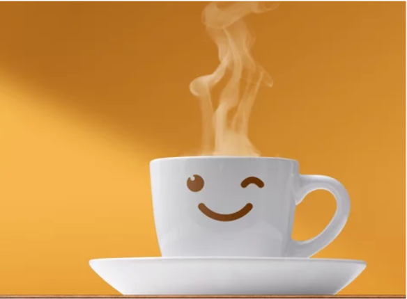 Smiling cup with steam on orange