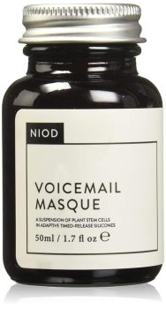 Small dark bottle of skincare product